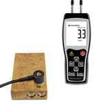 A device called BarScreenSensor, which is used for testing the authenticity of precious metal bars, along with a digital display showing a measurement, and a metal ingot beside it.